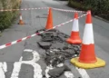 Road closed as large sinkhole opens up