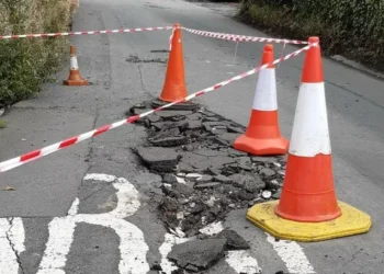 Road closed as large sinkhole opens up