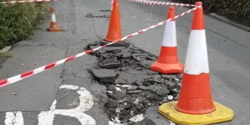 Road closed as large sinkhole opens up