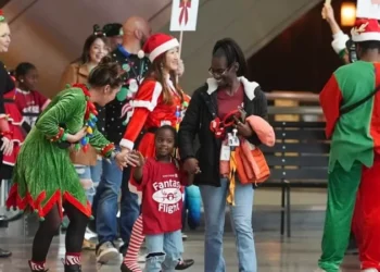 ‘North Pole’ flight takes kids to Santa in transformed Denver airport hangar