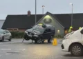 Car rescued by fire service after getting stuck on supermarket bollards