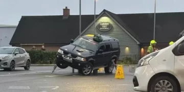Car rescued by fire service after getting stuck on supermarket bollards