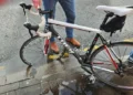 Cyclist flung over handlebars after hitting hidden pothole on main city road