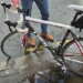 Cyclist flung over handlebars after hitting hidden pothole on main city road