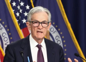 Fed holds rates steady, flags rising risks of inflation and unemployment