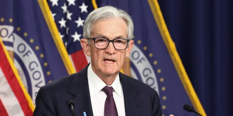 Fed holds rates steady, flags rising risks of inflation and unemployment