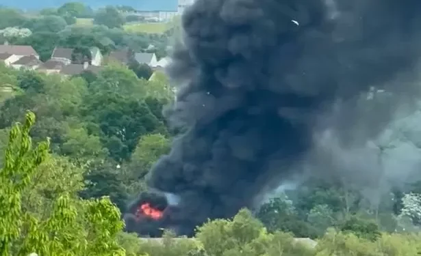 Fire crews deal with huge fire as smoke seen for miles