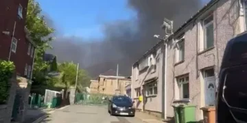 Residents told to keep windows and doors closed as smoke billows above town