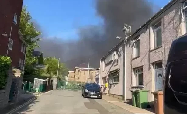 Residents told to keep windows and doors closed as smoke billows above town