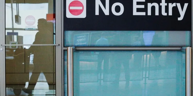 Trump’s new travel ban takes effect amid escalating tension over immigration enforcement