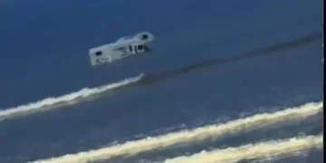 Campervan swamped by sea at notorious Welsh beach