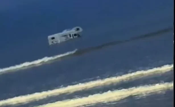 Campervan swamped by sea at notorious Welsh beach