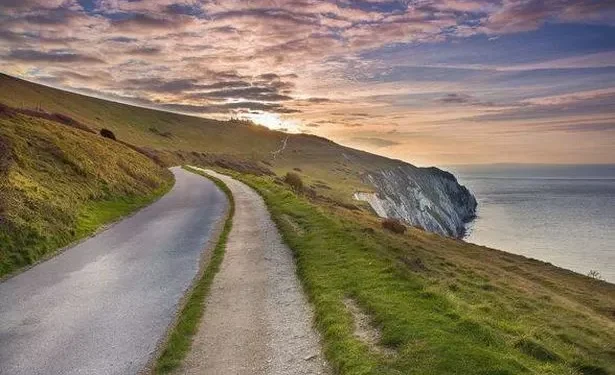 Two die as car plunges off cliff into sea at popular UK beauty spot