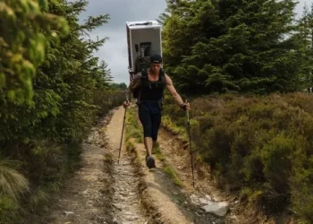 Man treks 70 miles across Welsh mountains with a fridge on his back in memory of his wife