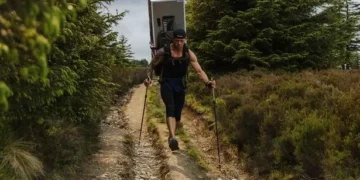 Man treks 70 miles across Welsh mountains with a fridge on his back in memory of his wife
