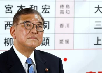 Japan’s ruling bloc suffers double blow, Ishiba vows to stay on
