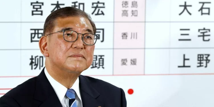 Japan’s ruling bloc suffers double blow, Ishiba vows to stay on