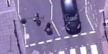 Dramatic moment police run through busy streets and floor drug dealer captured on helicopter camera