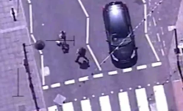Dramatic moment police run through busy streets and floor drug dealer captured on helicopter camera