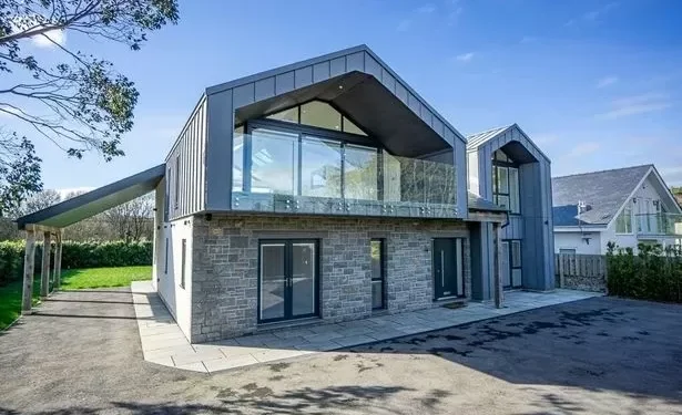 Dated seaside bungalow transformed into huge modern mansion