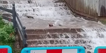 New ‘waterfall’ feature explodes out into street in middle of the night threatening homes