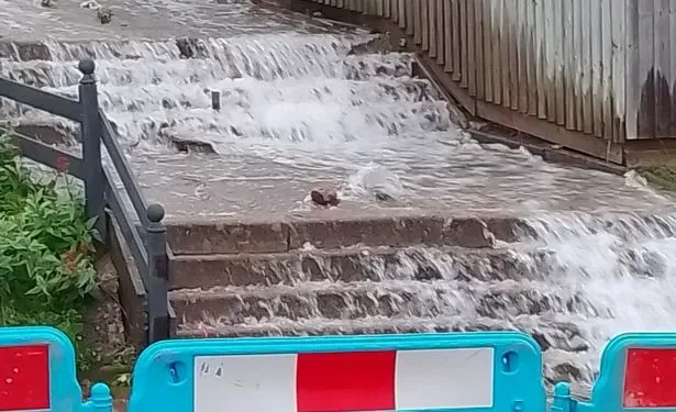 New ‘waterfall’ feature explodes out into street in middle of the night threatening homes