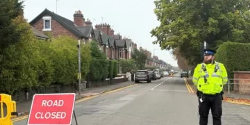 Police name children, two and three, found dead as woman arrested