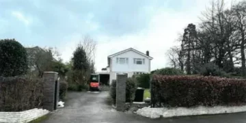 Family ordered to take down their front garden fence